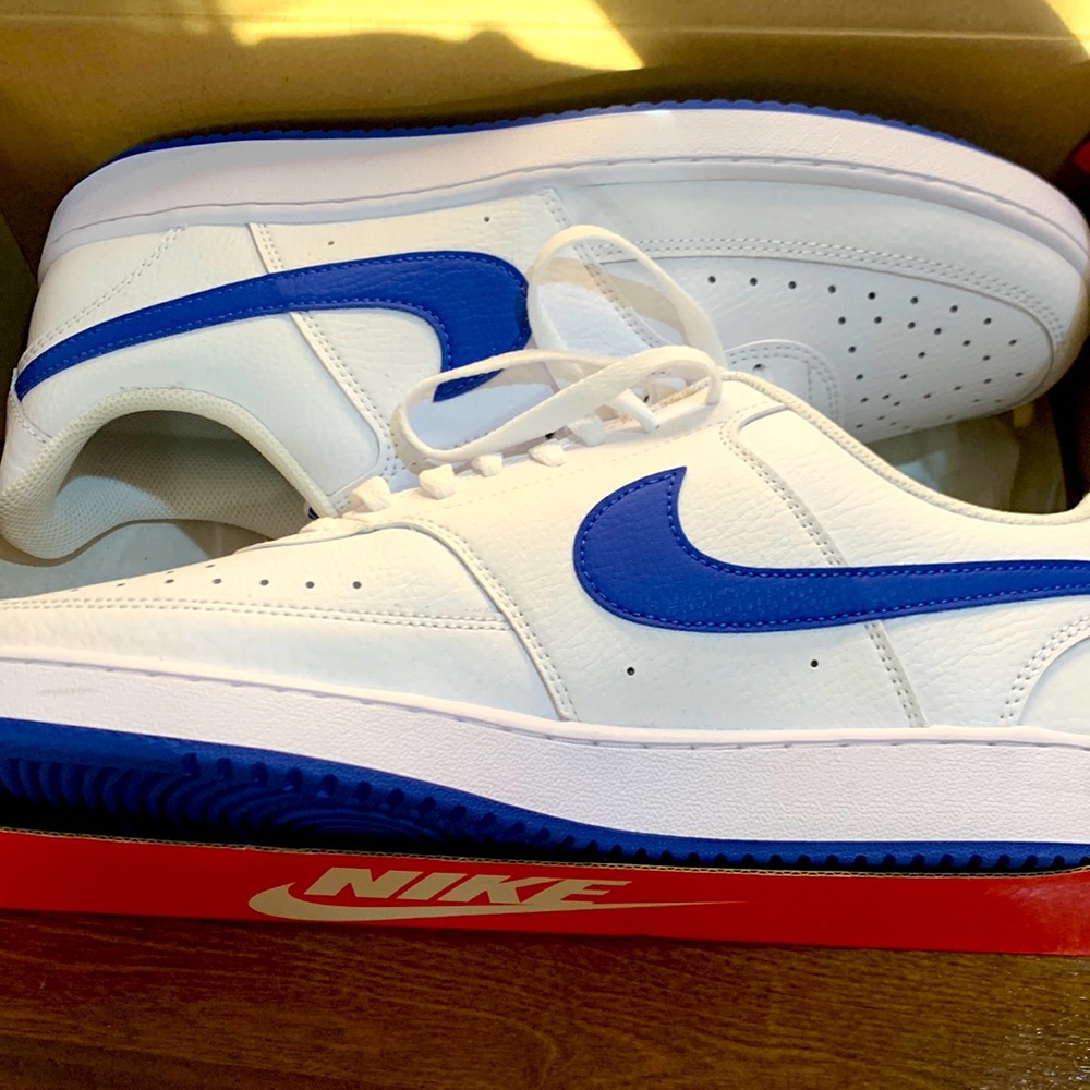 WORN ONLY ONCE in house white and blue Nike low top sneakers to right
